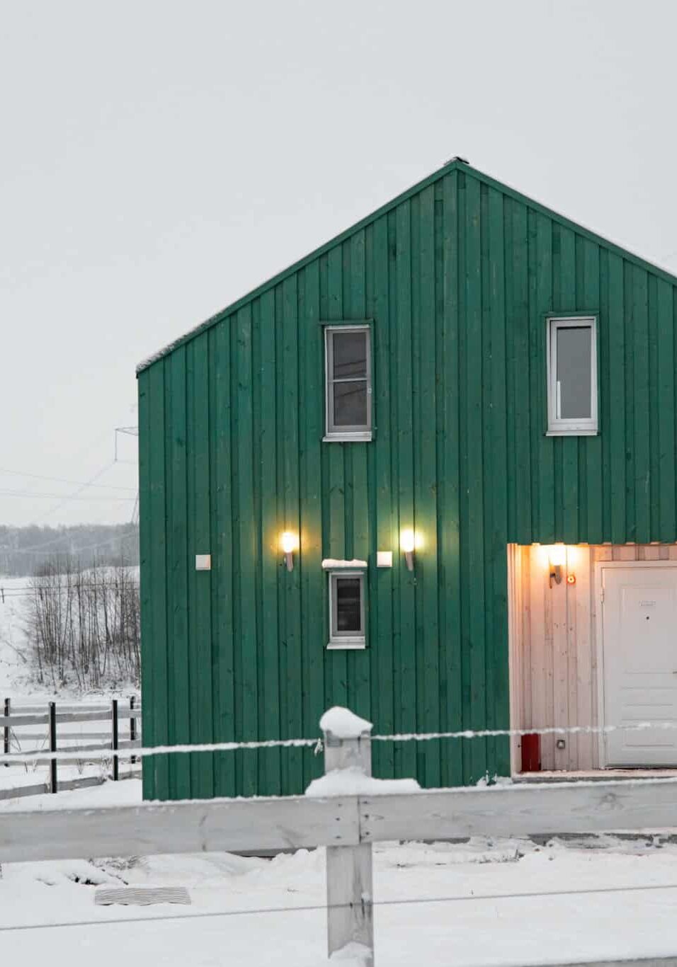 Modern wood house in the Scandinavian style with different color , winter day in village Modern wood house in the Scandinavian style with different color , winter day in village side view